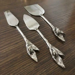 Olive Branch Stainless Steel Cheese Knife Set 5 Olive Branch Stainless Steel Cheese Knife Set -THE HOLIDAY SHOP Olive Branch Silver Cheese Knives Close UP